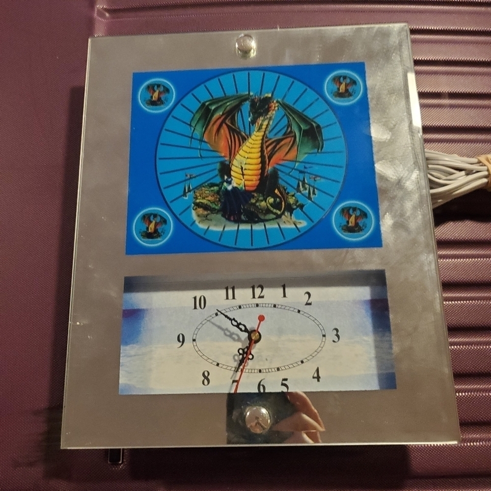 This is a vintage moving clock mirror w/ Dragon